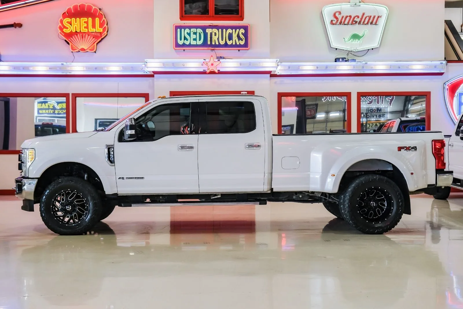 White Ford F-350 dually 4x4 crew cab bought by Texas Motorcars
