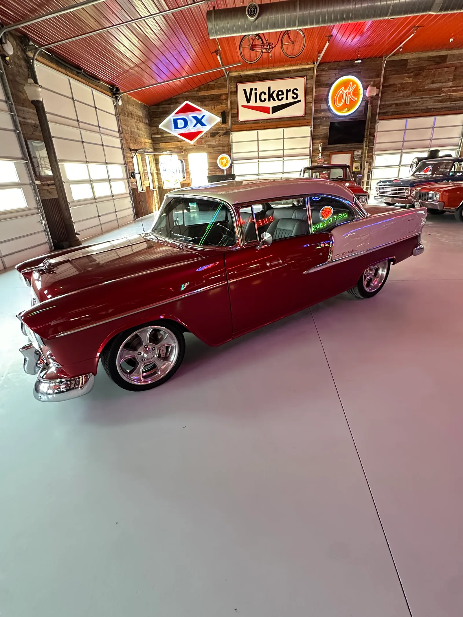 Restored 1955 Chevrolet Bel Air classic car in deep red